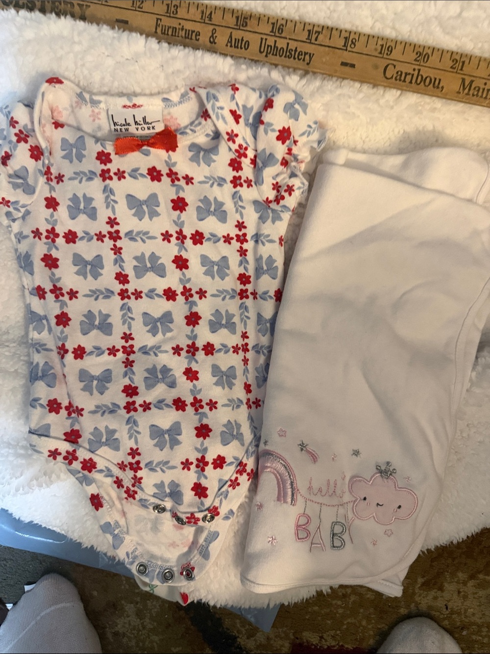 Receiving blanket and onesie. 6-9